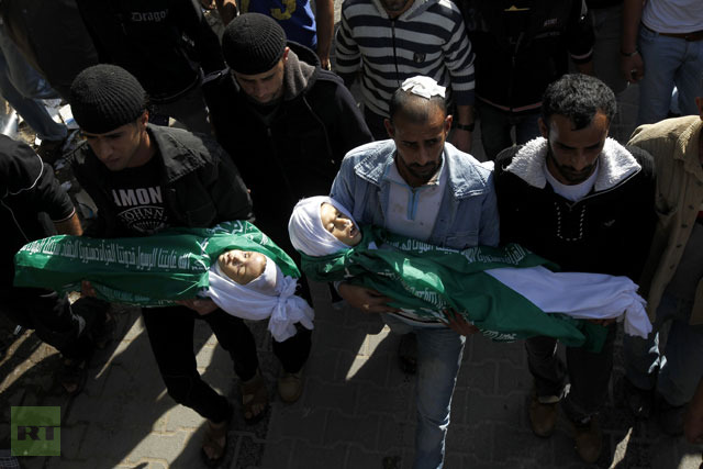 Palestinians carry the body of Jumana Abu Sefan (L), 18 months, and her brother Tamer, three and a half years old, during their funeral in the village of Beit Lahia, in the northern Gaza Strip.(AFP Photo / Mohammed Abed)
